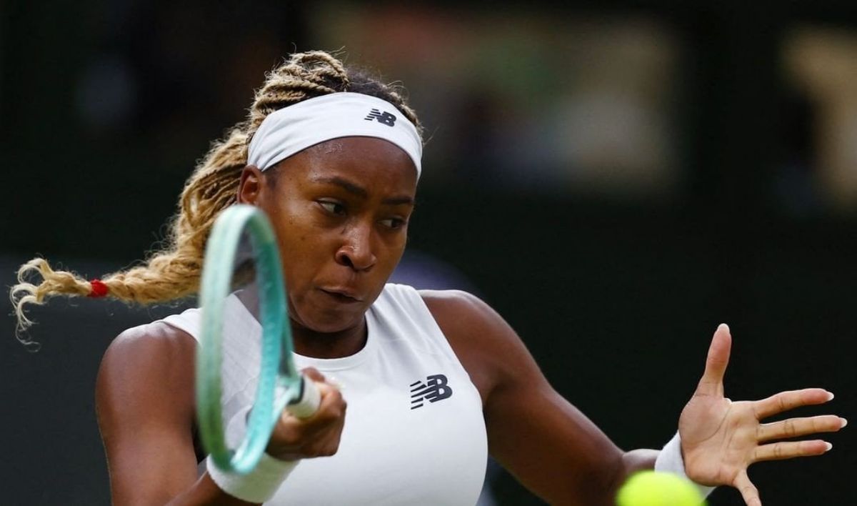 Coco Gauff in action at Wimbledon 2024, hitting a backhand shot during her match against Emma Navarro.