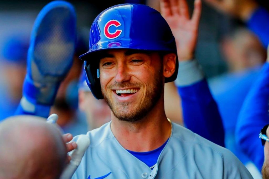 Cody Bellinger wearing his team uniform, preparing to swing a baseball bat during a game.